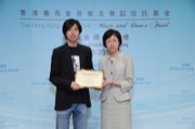 Miss WONG Yuet-wah, Principal Assistant Secretary for Home Affairs, awarded a music scholarship to Mr LO Ting-cheung