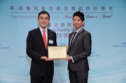 Mr Douglas SO, Executive Director of Charities of The Hong Kong Jockey Club, awarded a dance scholarship to Mr CHAN Kin-shun