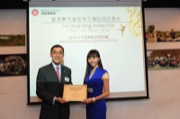 Mr Douglas SO, Executive Director of Charities of The Hong Kong Jockey Club awarded a dance scholarship to Miss LI Yiran