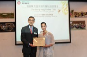 Mr Douglas SO, Executive Director of Charities of The Hong Kong Jockey Club awarded a dance scholarship to Miss YIU Kit-ki