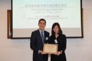 Mr Douglas SO, Executive Director of Charities of The Hong Kong Jockey Club awarded a dance scholarship to Miss Lilly WU