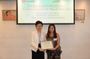 Miss WONG Yuet-wah, Principal Assistant Secretary for Home Affairs awarded a non-local dance scholarship to Miss Cherry LEUNG