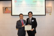 Mr Leong CHEUNG, Executive Director of Charities and Community of The Hong Kong Jockey Club awarded a local music scholarship to Mr Jacky LEUNG